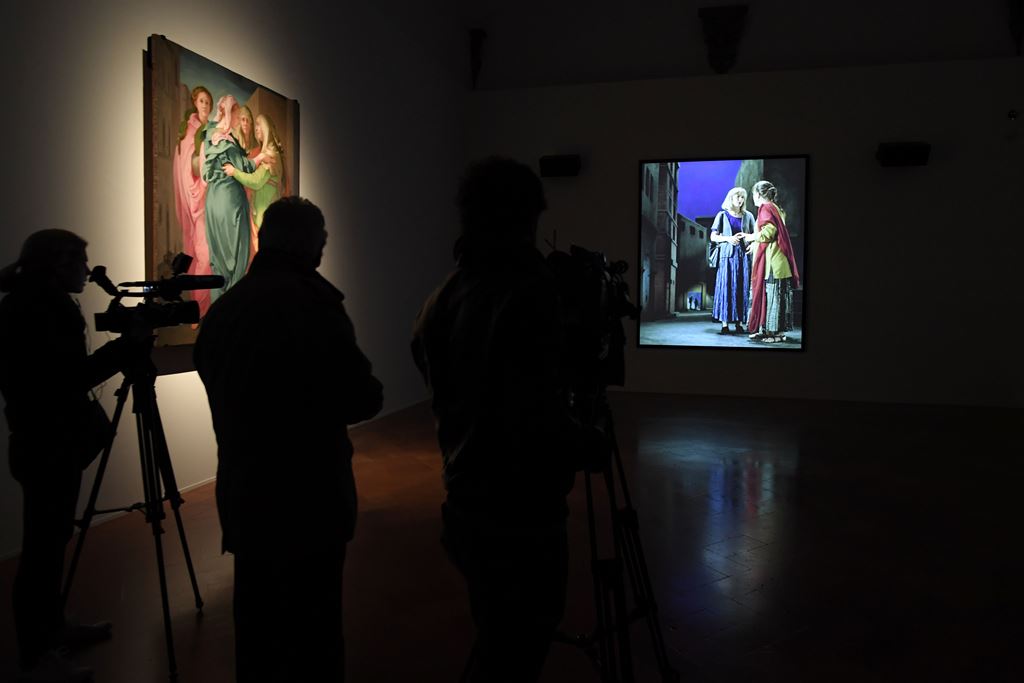 A journalist watches a video by US artist Bill Viola during a press preview of the exhibition 