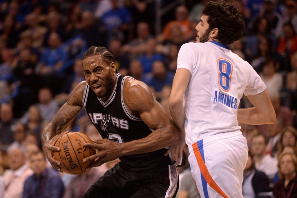 San Antonio Spurs forward Kawhi Leonard (2) moves to the basket in front of Oklahoma City Thunder guard Alex Abrines (8) during the third quarter at Chesapeake Energy Arena. Mark D