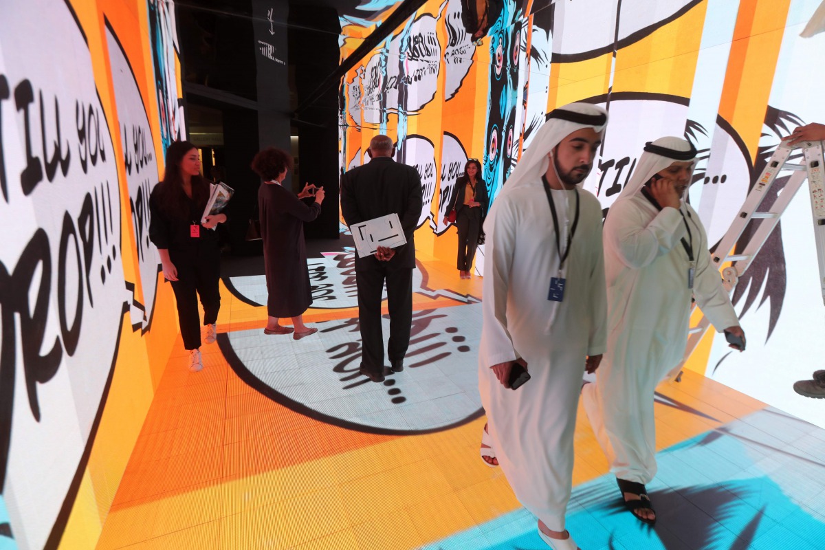 People visit the Art Dubai exhibition in the Gulf emirate on March 14, 2017, on the eve of the opening of the 11th annual art fair, billed as the largest contemporary art show in the Middle East and North Africa. AFP / Karim Sahib