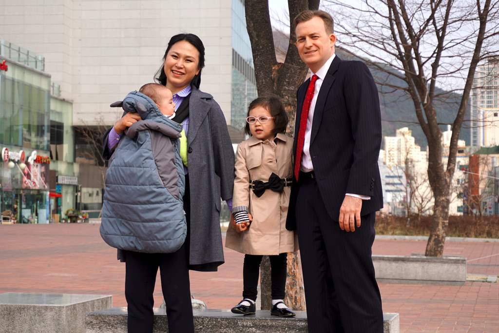 Robert Kelly (R), an expert on East Asian affairs and a professor at South Korea's Pusan National University, his wife Kim Jung-A (L), daughter Marion (2nd R) and toddler son James pose during an interview with AFP at the university in Busan on March 15, 