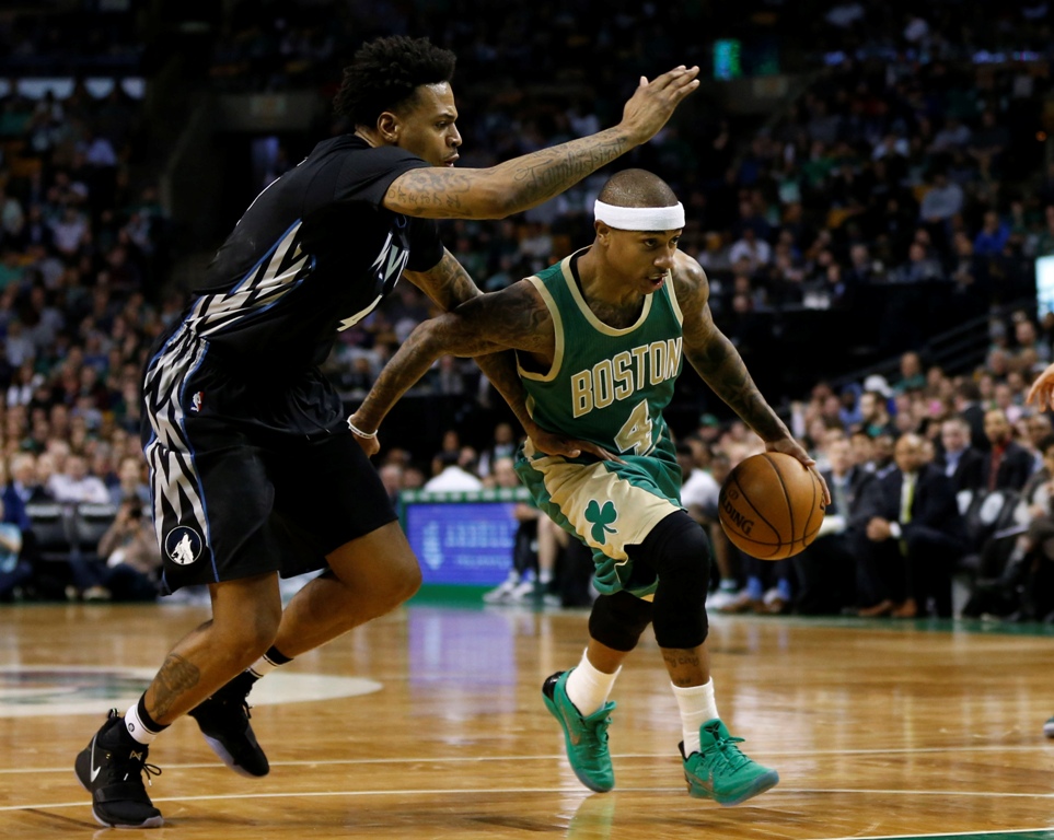 Boston Celtics point guard Isaiah Thomas (4) drives while guarded by Minnesota Timberwolves guard Brandon Rush (4) during the third quarter at TD Garden. The Boston Celtics won 117-104. Credit: Greg M. Cooper
