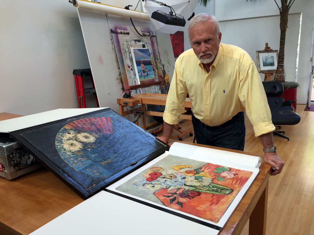 Steve Meadows, an architect, actor, inventor and dabbler in art, poses in his Venice, California, home on February 14, 2017, with two paintings he shipped to the Van Gogh Museum in Amsterdam for an authentication review as possible works by the Dutch mast