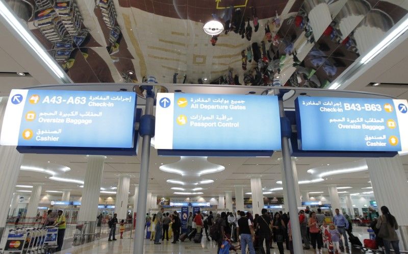 Travellers are seen at the Emirates terminal at Dubai International Airport. (Reuters)