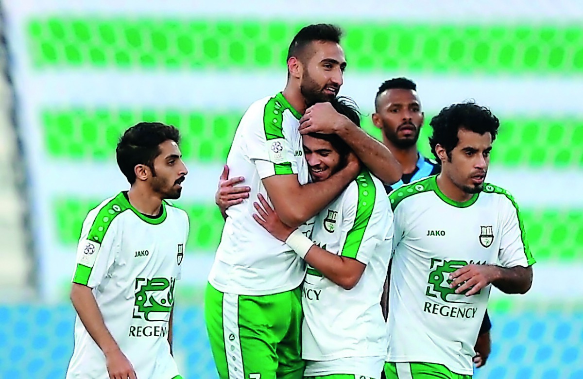 Al Ahli players celebrate after scoring a goal in this file photo.