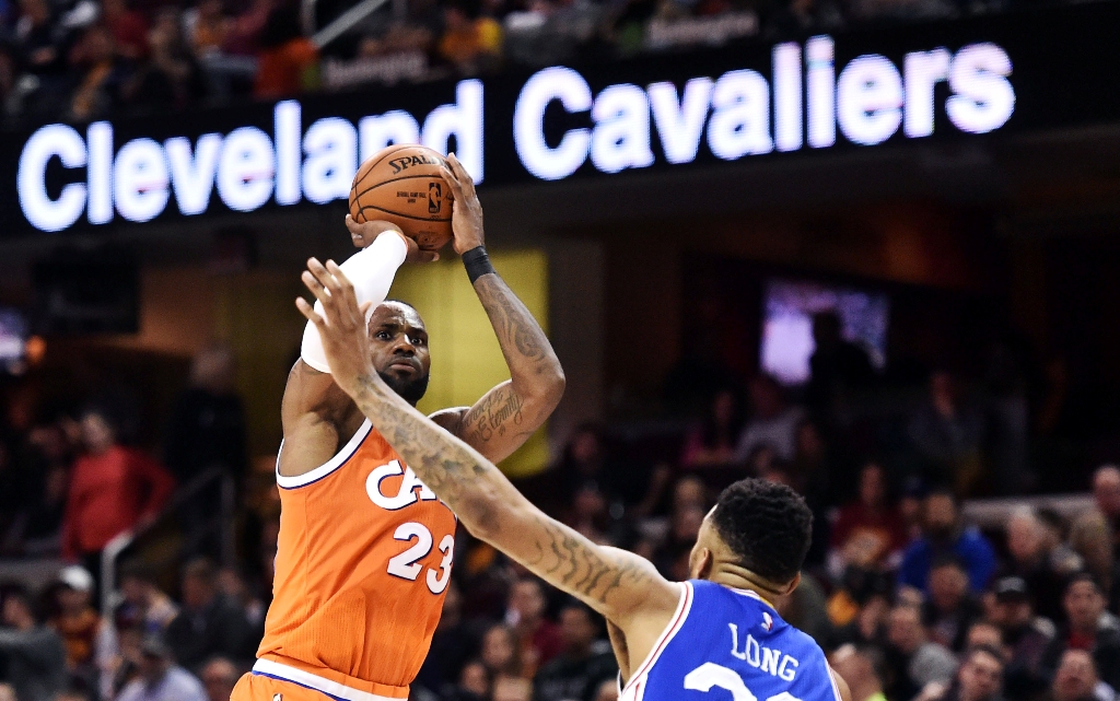 Cleveland Cavaliers forward LeBron James (23) shoots over the defense of Philadelphia 76ers forward Shawn Long (36) during the second half at Quicken Loans Arena. The Cavs won 122-105. Ken Blaze
