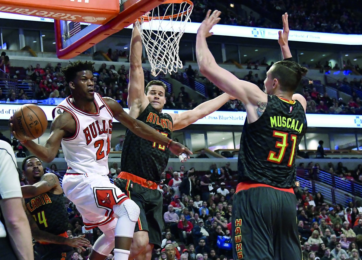 Chicago Bulls forward Jimmy Butler (left) in action against Atlanta Hawks forward Mike Muscala (right) during the first quarter of their NBA game in Chicago on Saturday. 