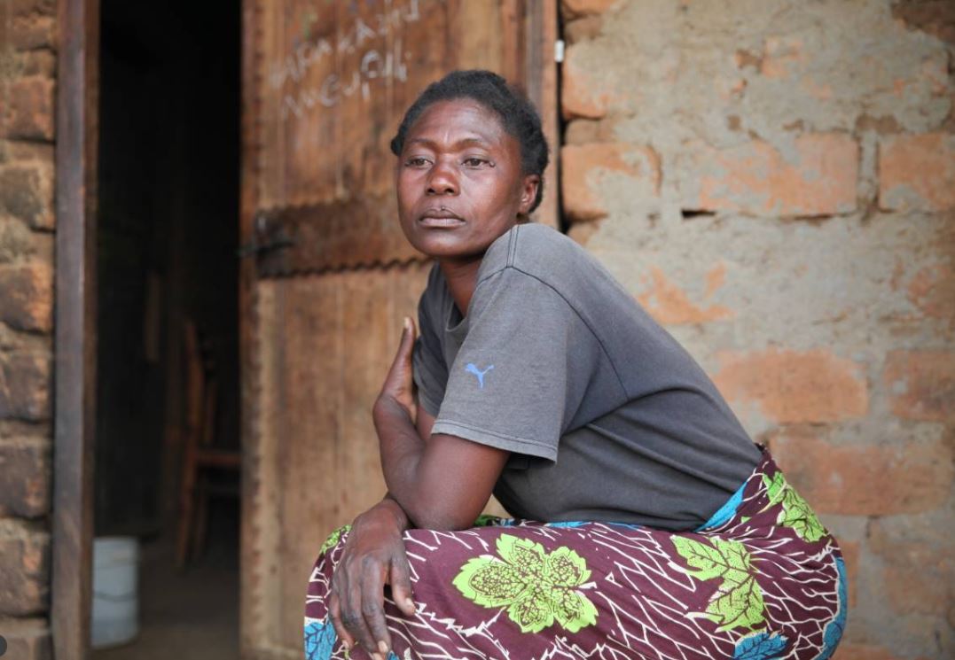 Tanzanian widow Rosemary Cyprian poses after an interview outside her home on Ukerewe Island on on 24 February 2017. TRF/Katy Migiro