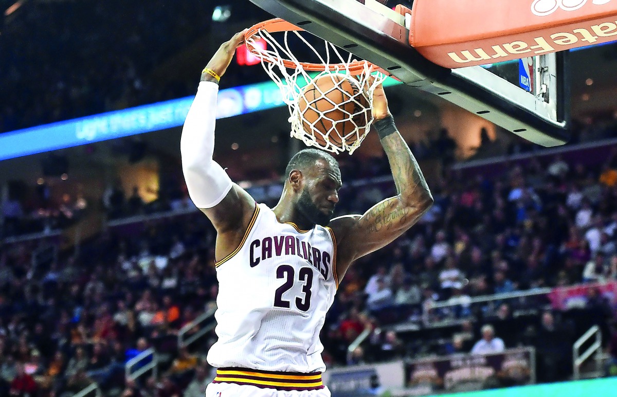 Cleveland Cavaliers forward LeBron James slam dunks during the second half of NBA game against the Orlando Magic at Quicken Loans Arena on Wednesday. 