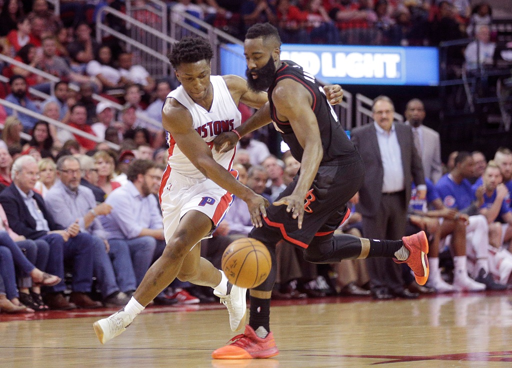 Detroit Pistons forward Stanley Johnson (7) and Houston Rockets guard James Harden (13) reach for a loose ball in the second half at Toyota Center. Detroit Pistons won 114-109 .Credit: Thomas B. Shea