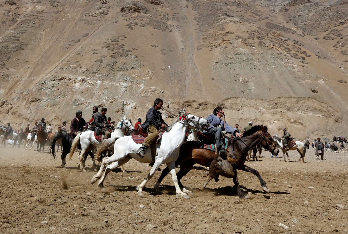 Afghan horsemen compete during a Buzkashi game in Panjshir province, north of Kabul, Afghanistan April 7, 2017. REUTERS/Omar Sobhani