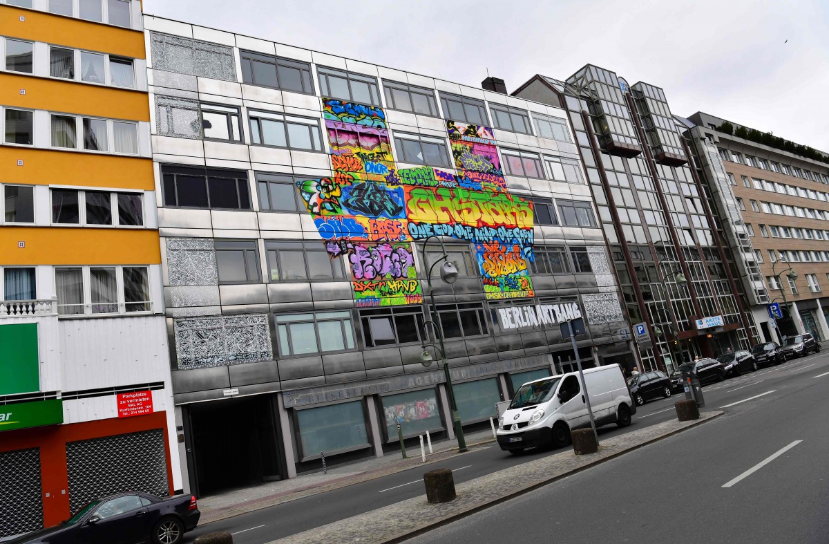 This picture taken on April 3, 2017 shows The Haus (The House), an old bank building housing an urban art project in Berlin. In Berlin, arguably Europe's urban art capital, some 165 like-minded street artists have filled the five-storey space with their w