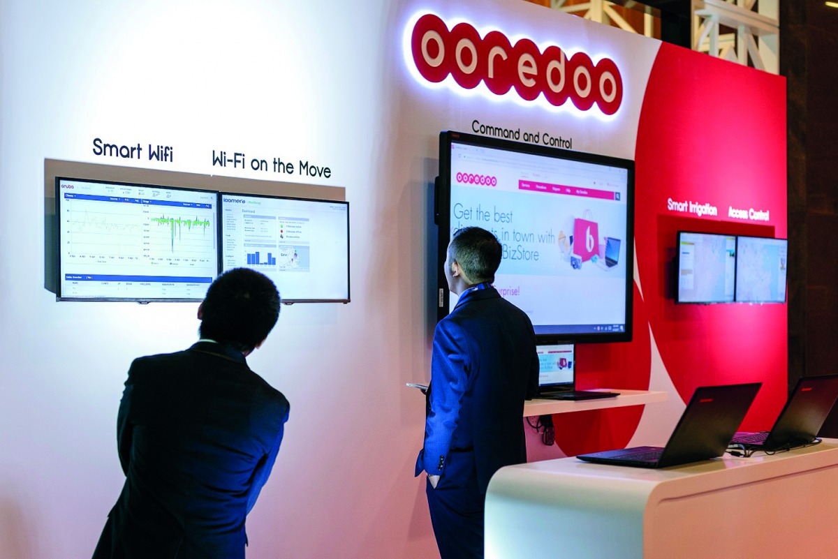 Visitors at the Ooredoo booth at the Arab Future Cities Summit. 