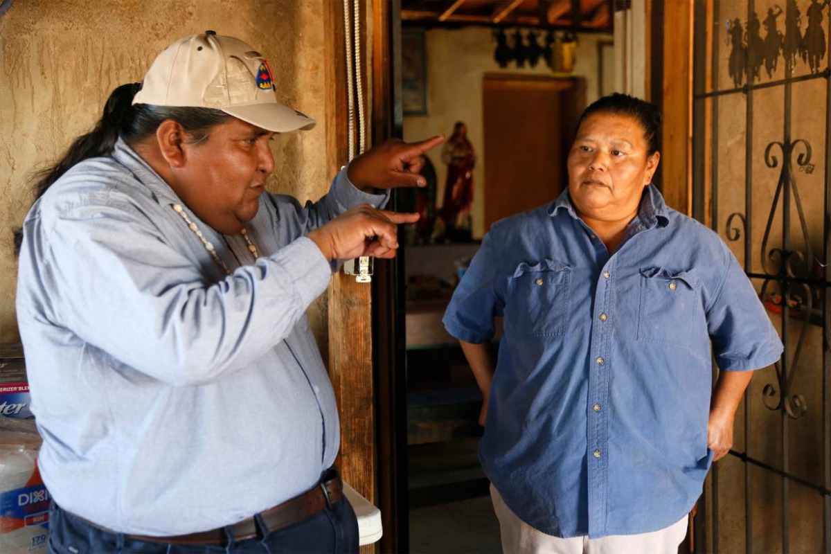 Verlon Jose (L), vice-chairman of the Tohono O'odham Nation, talks to his cousin Francine Jose on her family ranch near the U.S.-Mexico border on the Tohono O'odham reservation in Chukut Kuk, Arizona April 6, 2017. Picture taken April 6, 2017. REUTERS/Ric