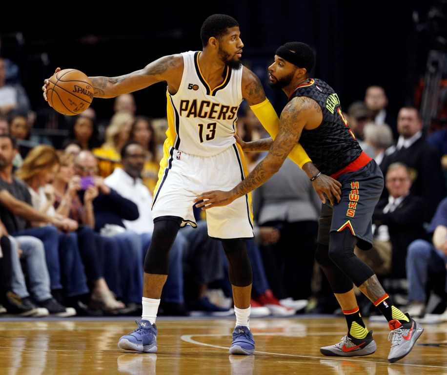 Apr 12, 2017; Indianapolis, IN, USA; Indiana Pacers forward Paul George (13) is guarded by Atlanta Hawks guard Malcolm Delaney (5) at Bankers Life Fieldhouse. Indiana defeats Atlanta 104-86. Brian Spurlock
