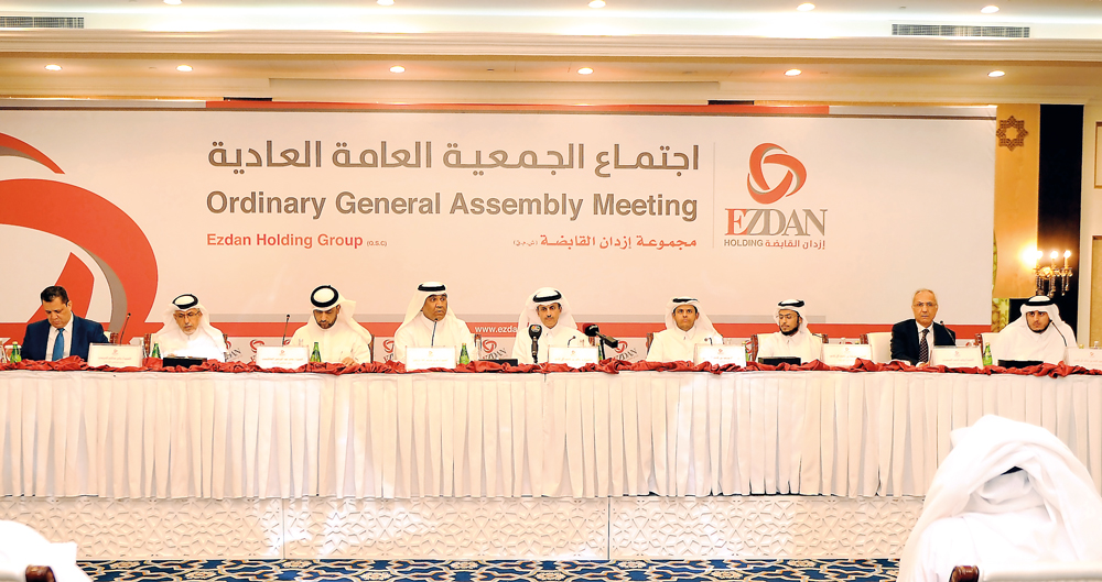 Sheikh Dr Khalid bin Thani bin Abdullah Al Thani (right), Chairman of Ezdan Holding Group; Ali Mohammed Al Obaidli (second right), CEO of Ezdan Holding Group and other senior officials at the Ordinary General Assembly meeting of the Group held at Ezdan To