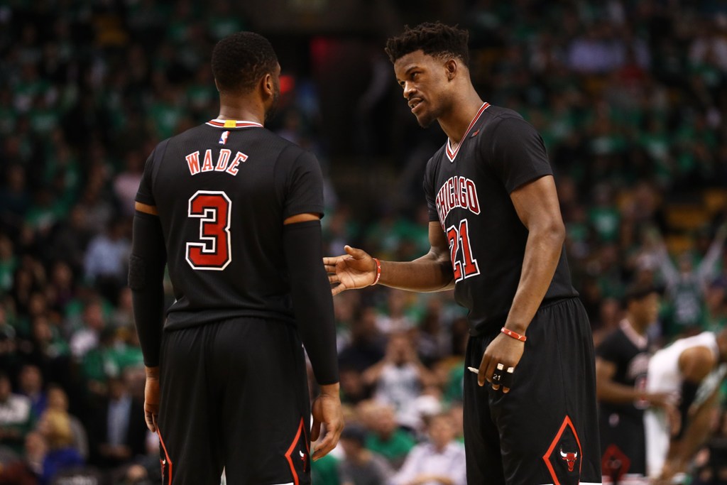 Jimmy Butler #21 of the Chicago Bulls talks with Dwyane Wade #3 during the third quarter of Game Two of the Eastern Conference Quarterfinals against the Boston Celtics at TD Garden on April 18, 2017 in Boston, Massachusetts.  Maddie Meyer/AFP
