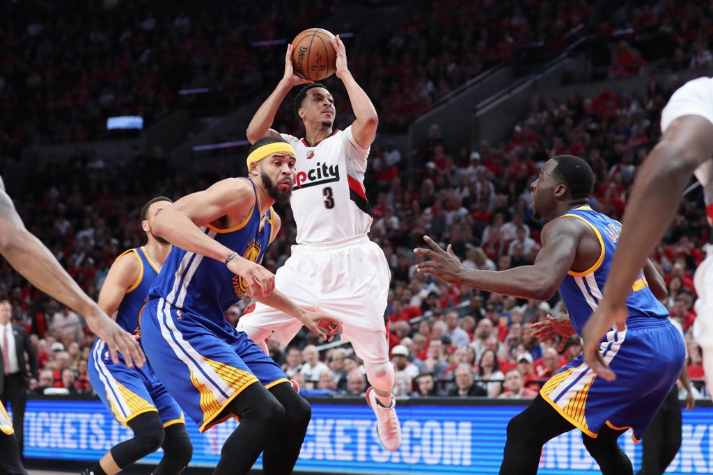 Portland Trail Blazers guard CJ McCollum (3) shoots over Golden State Warriors in the second half of game three of the first round of the 2017 NBA Playoffs at Moda Center. Jaime Valdez