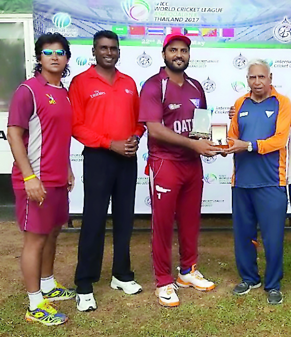 Awais Malik of Qatar poses with his Man-of-the-Match award along with Qatar Cricket Association (QCA) Operations Manager Mansoor Ahmed, after the seven-nation ICC World Cricket League Asia Division 1 match against Thailand in Thailand.