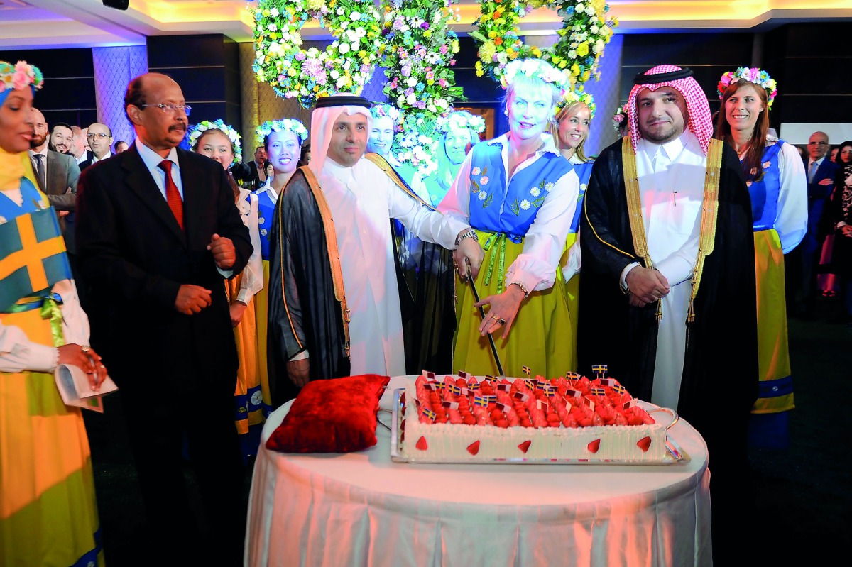 Ambassador of Sweden, Ewa Polano (centre), cutting a cake with H E Dr Mohammed bin Abdul Wahid Al Hammadi, Minister of Education and Higher Education (second left), Dean of the Diplomatic Corps Ali Ibrahim Ahmed (left) and Ibrahim Fakhroo, Director of Pro