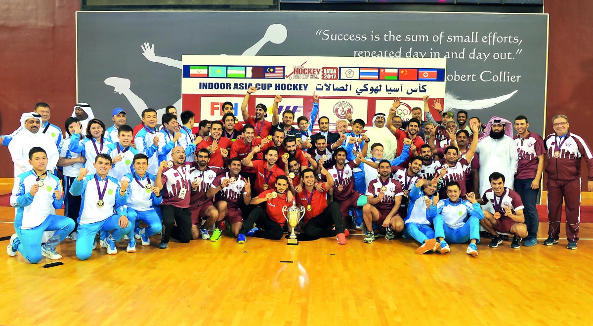 Asia Cup Indoor Hockey Champions Iran, runners-up Kazakshtan and bronze medallists Qatar team players and officials pose for a photograph following the presentation ceremony at the Aspire Dome yesterday.  Picture: Kamutty VP/The Peninsula