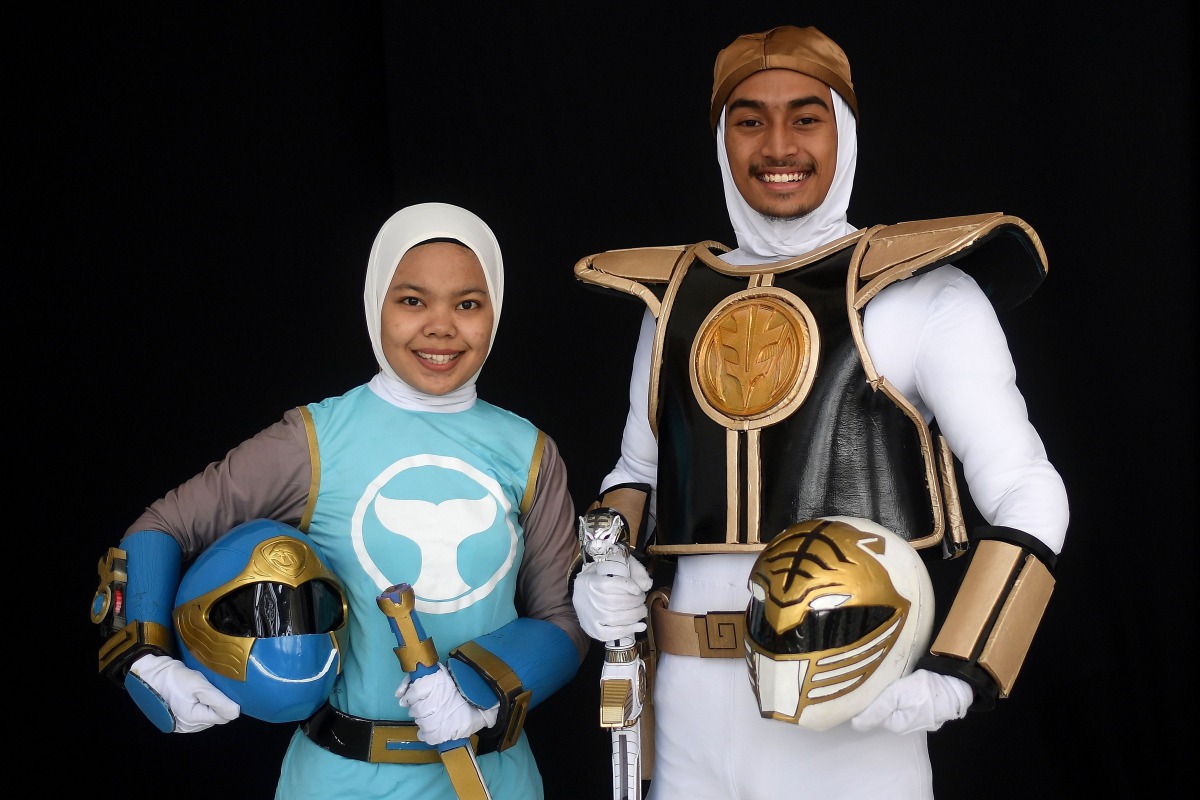 Muslim cosplay enthusiasts Azlyna Zaina (L) and Raja Mohd Rusydi, dressed as 