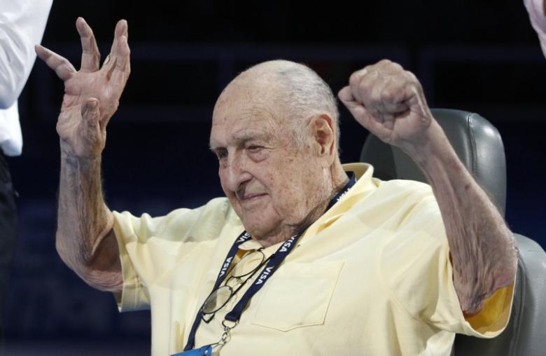 Adolph Kiefer, winner of the 1936 Olympic gold medal for the men's 100m backstroke, raises his arms before the medal ceremoney during the U.S. Olympic swimming trials in Omaha, Nebraska, June 27, 2012. REUTERS/Jeff Haynes