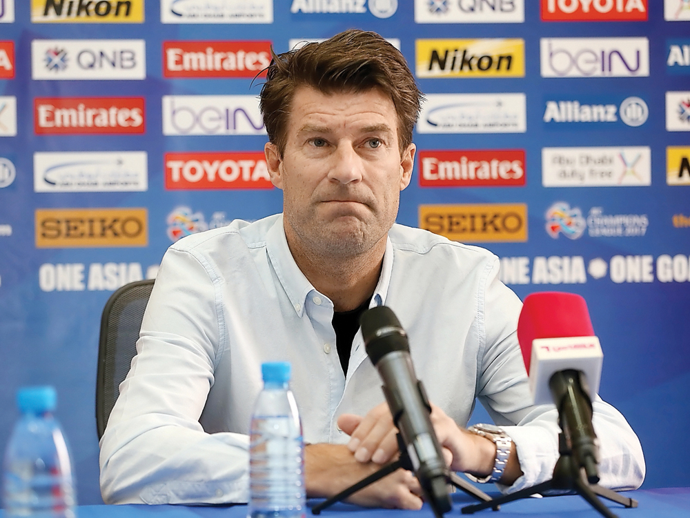 Al Rayyan coach Michael Laudrup speaks during a press conference .