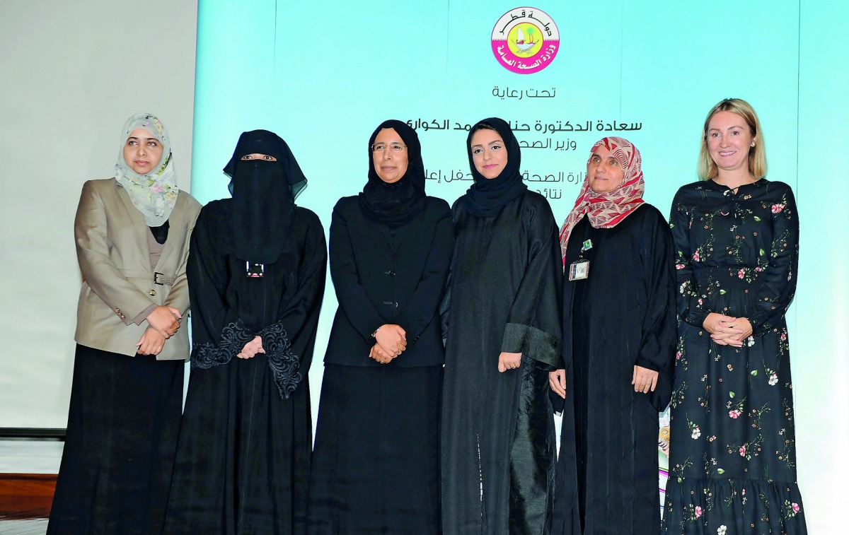 H E Dr Hanan Mohamed Al Kuwari (third left), Minister of Public Health; and Sheikha Dr Al Anoud bint Mohamed Al Thani (second left), Director of Health Protection and Non-communicable Diseases, with the winners of ‘Cook Healthy-Live Healthy’ competition y