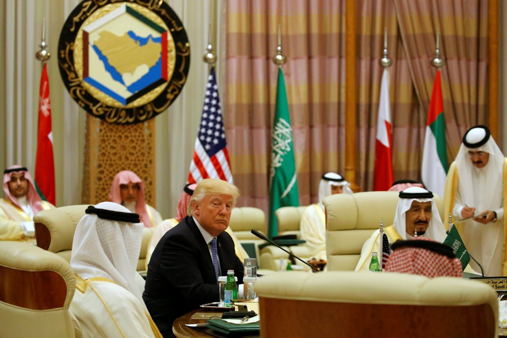 U.S. President Donald Trump sits down to a meeting with of Gulf Cooperation Council leaders, including Saudi Arabia's King Salman bin Abdulaziz Al Saud (R), during their summit in Riyadh, Saudi Arabia May 21, 2017. REUTERS/Jonathan Ernst