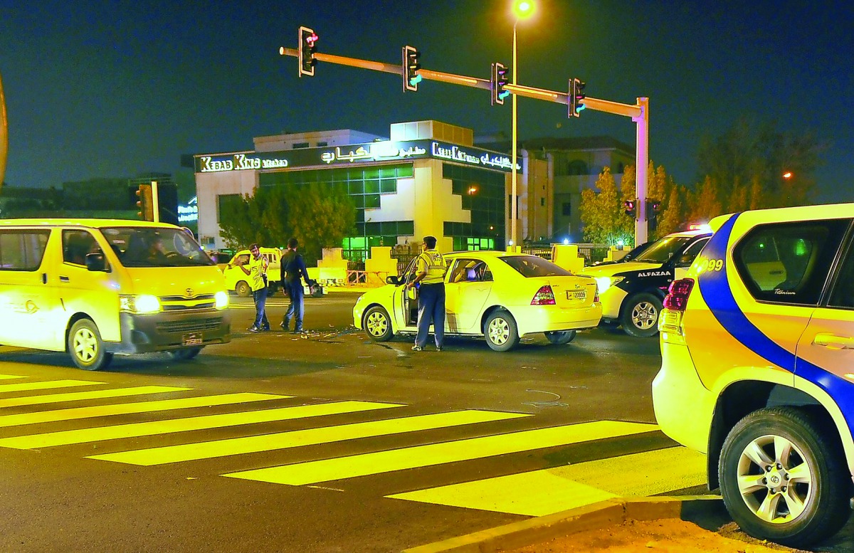 Al Fazaa and a traffic patrol regulate traffic following an accident at the an intersection. (file photo / Baher Amin)