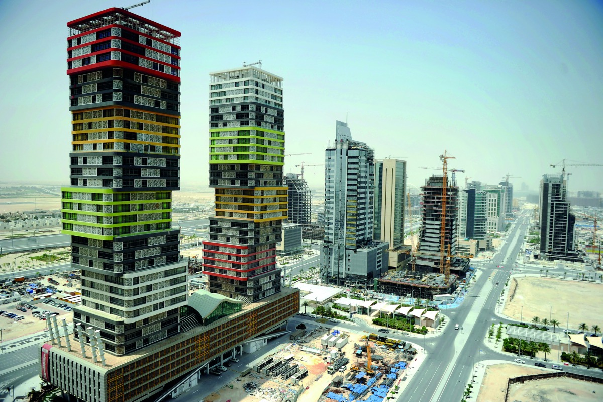 A view of the Lusail City skyline with a pair of colourful towers in the foreground. (Photo: Abdul Basit)
