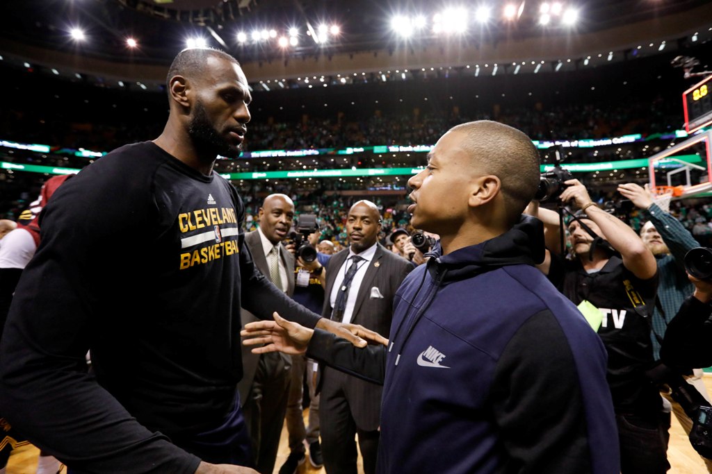 Cleveland Cavaliers forward LeBron James (23) and Boston Celtics guard Isaiah Thomas (4) meet after game five of the Eastern conference finals of the NBA Playoffs at the TD Garden. Greg M. Cooper