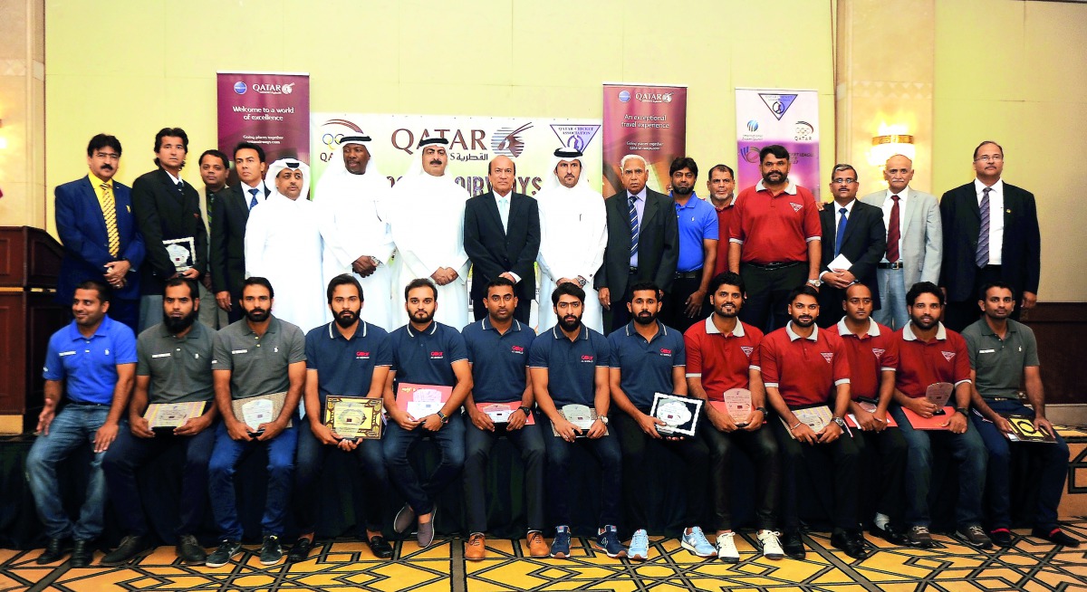 President of Qatar Rugby, Hockey and Cricket Federation Youssef Jaham Al Kuwari poses for a photograph with officials and Qatar national cricket team players during a gala dinner held at the Doha Marriott Hotel on Friday. Picture: Abdul Basit/The Peninsul