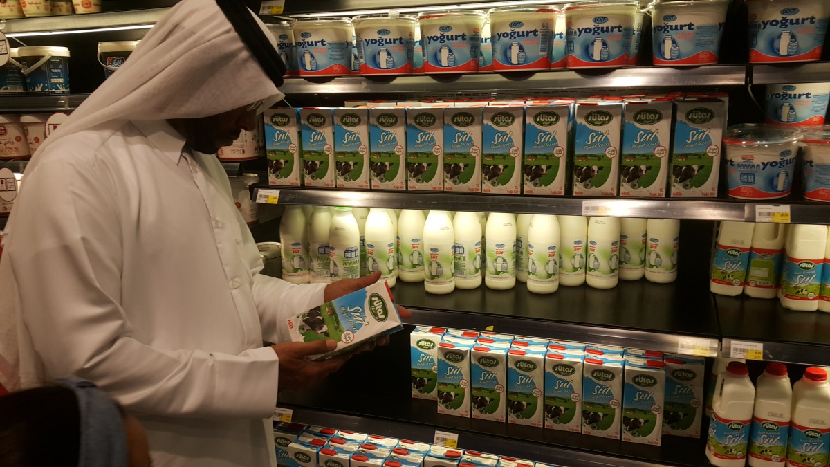 A customer examines a tetra-pack diary prodcut at a hypermarket in Doha. Pic: Abdul Basit