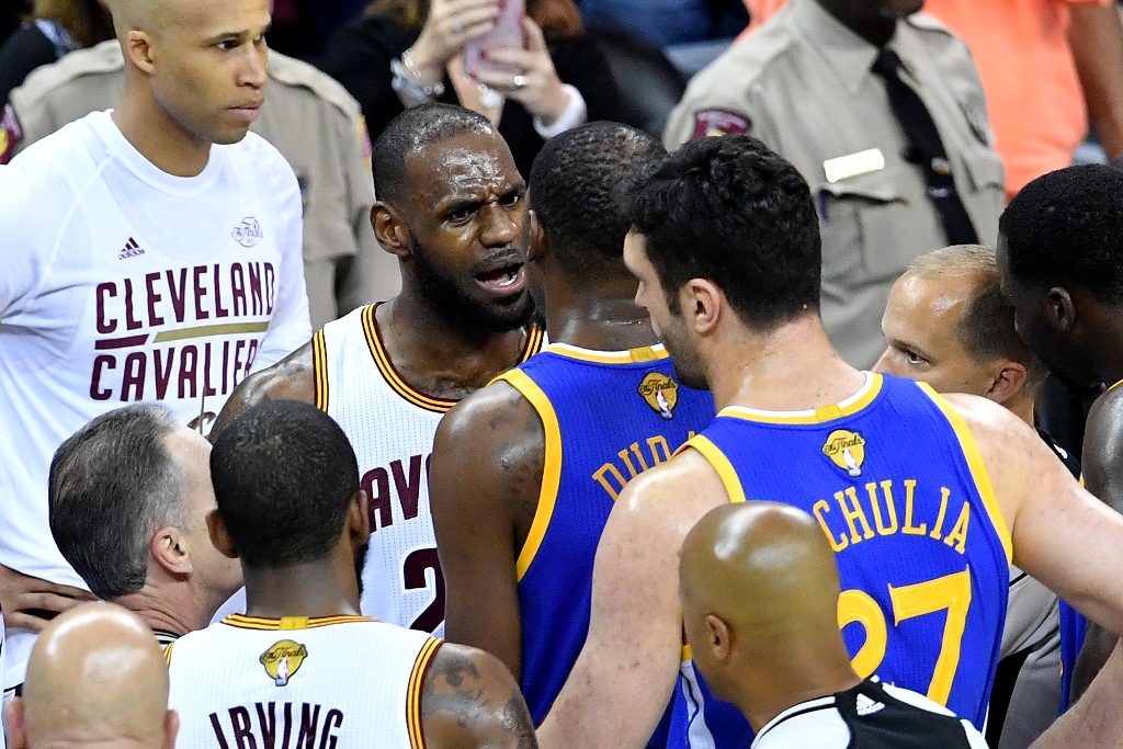 LeBron James #23 of the Cleveland Cavaliers and Kevin Durant #35 of the Golden State Warriors speak after a foul in the third quarter in Game 4 of the 2017 NBA Finals at Quicken Loans Arena on June 9, 2017 in Cleveland, Ohio. AFP Jason Miller
