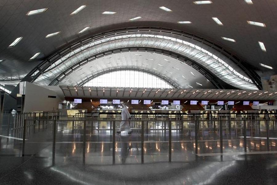 A Reuters file photo of a passenger walking in to the Hamad International Airport terminal. 