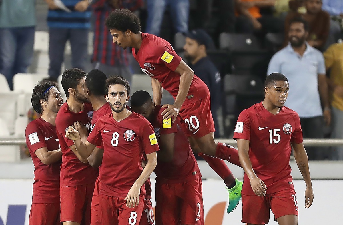 Qatar's players celebrate after scoring a goal during the World Cup 2018 Asia qualifying match against  South Korea at the Jassim Bin Hamad Stadium in Doha yesterday. 