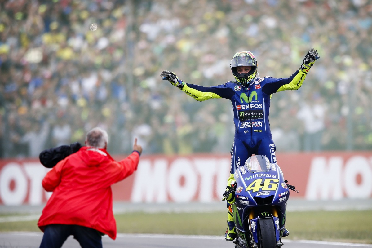 Italy's Valentino Rossi celebrates after winning the Assen Motorcycling Grand Prix at the TT circuit in Assenon on June 25, 2017. (AFP / ANP / Vincent Jannink)