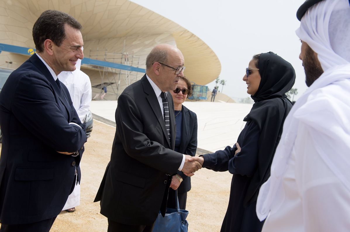 French Foreign Minister Jean-Yves Le Drian welcomed by Chairperson of Qatar Museums, H E Sheikha Al Mayassa bint Hamad Al Thani. (photo:Twitter)