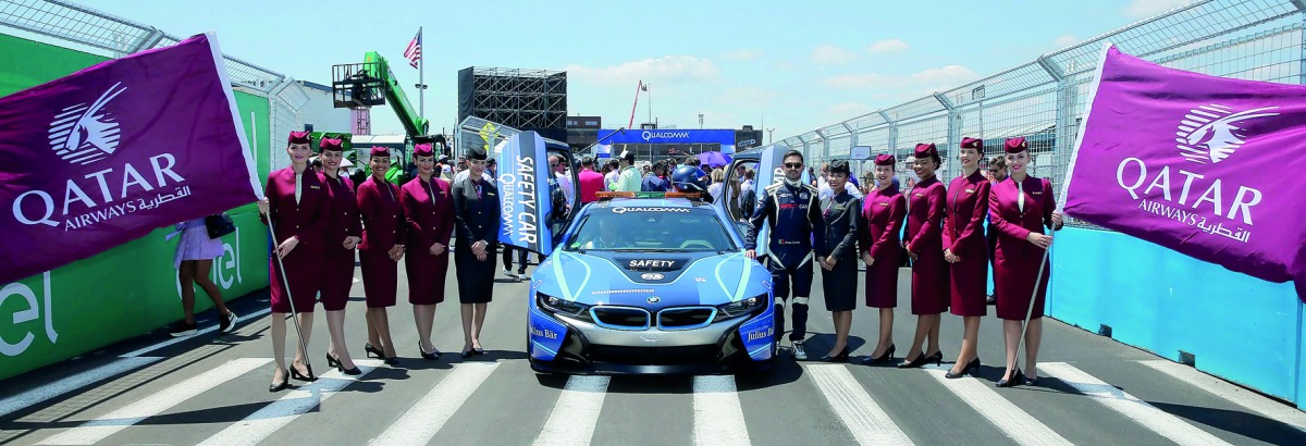 Qatar Airways hostesses with Sam Bird, winner of the 2017 New York City ePrix, at the Brooklyn Cruise Terminal.