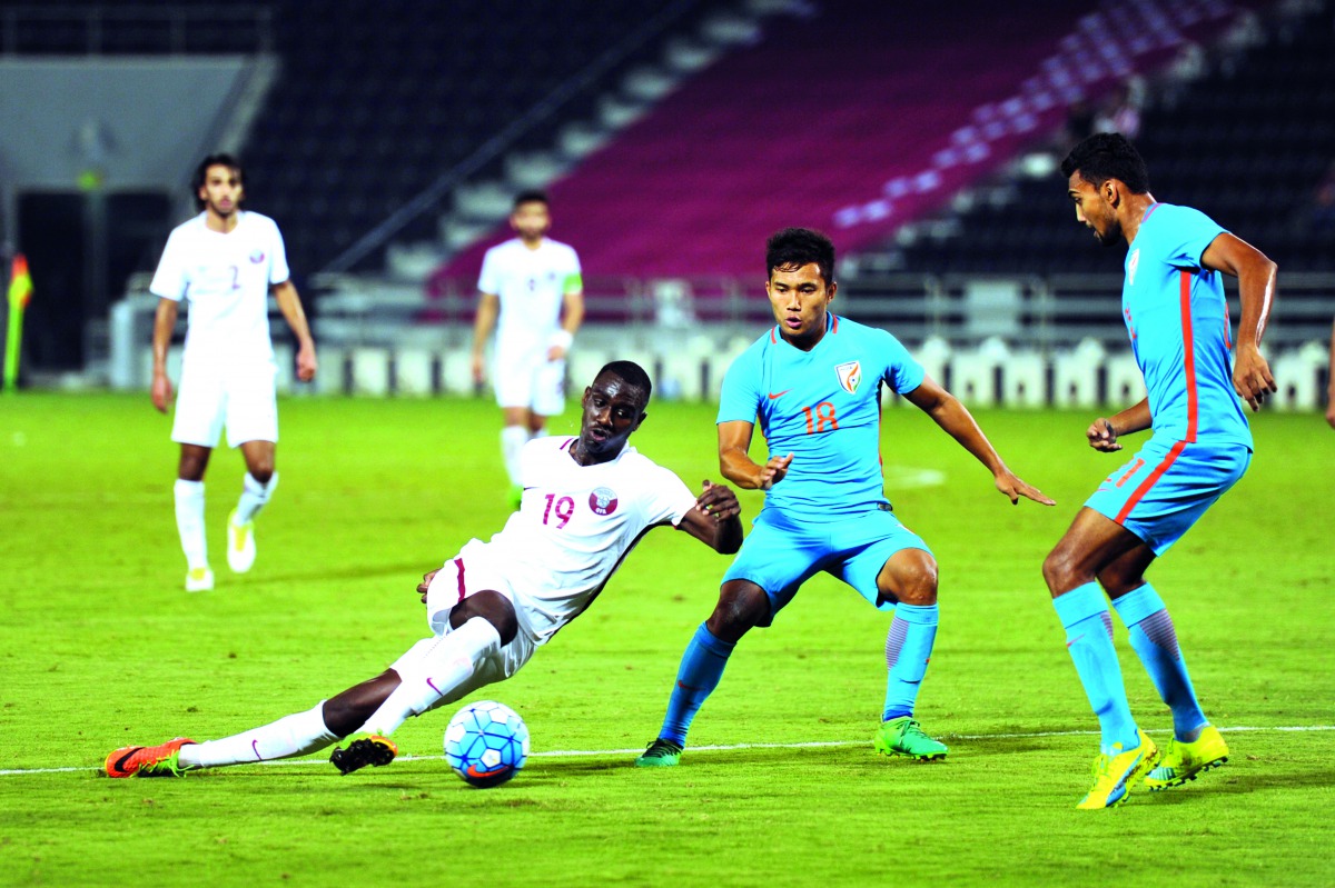 Qatar’s Al Moez Abdullah (left) kicks the ball during the AFC U-23 Championship qualifying match against India at Al Sadd Stadium yesterday. Abdullah scored in the 54th minute as Qatar beat India 1-0. Pictures by Kammutty VP / The Peninsula
