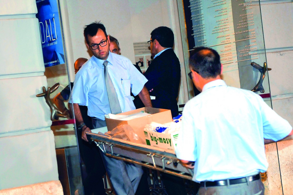 Forensic examiners leave the Teatre-Museu Dali following the exhumation of Salvador Dali's remains in Figueras, yesterday. 