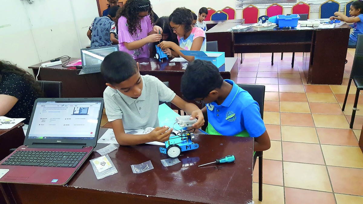 Children participating at a workshop on robotics.