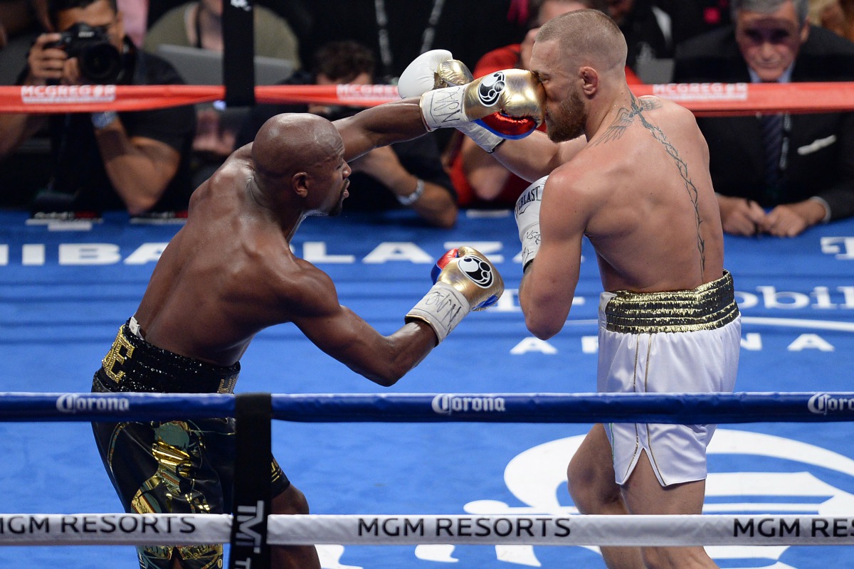 Floyd Mayweather Jr (black trunks) and Conor McGregor (white trunks) box during their boxing match at T-Mobile Arena. Mayweather won via tenth round TKO. (Joe Camporeale-USA TODAY Sports)