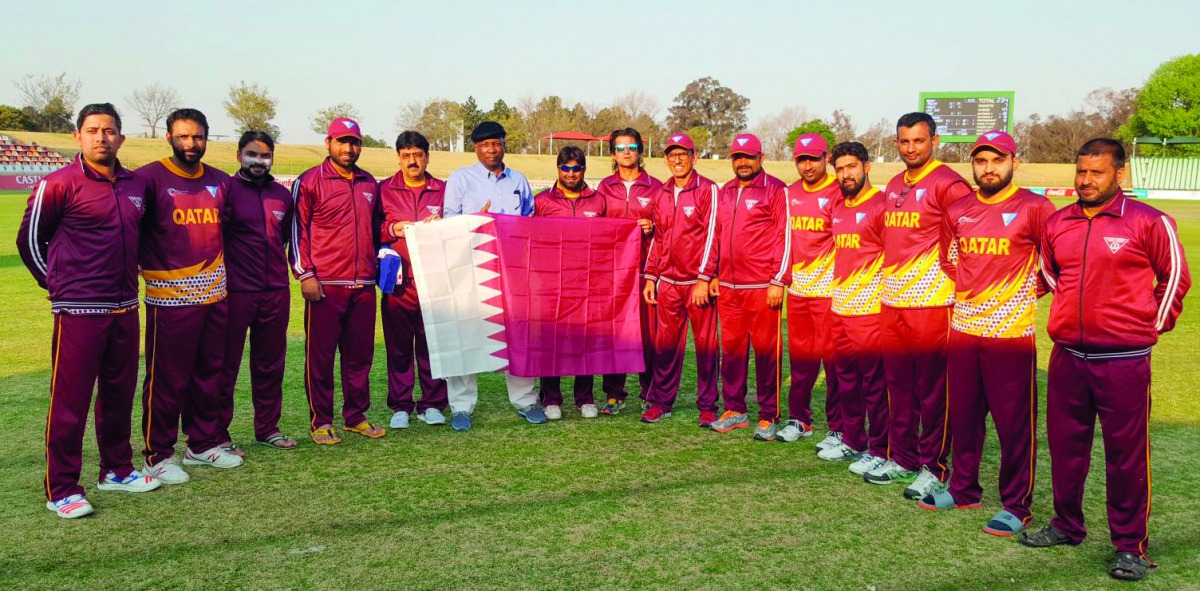 Qatar cricket team and officials pose for a photograph after winning their third Group match against Guernsey at the Willowmoore Park in Benoni, South Africa yesterday.