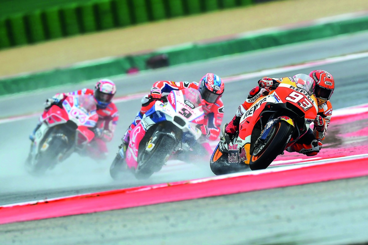 Repsol Honda Team’s Spanish rider Marc Marquez (right) leads ahead of Ducati Team’s Italian riders Danilo Petrucci (centre) and Andrea Dovizioso during the San Marino Moto GP event at the Marco Simoncelli Circuit in Misano yesterday.