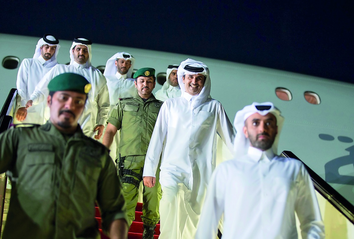 Emir H H Sheikh Tamim bin Hamad Al Thani receiving a grand welcome on his arrival in Doha yesterday. A large number of citizens and residents gathered along the Corniche to celebrate H H the Emir’s return.