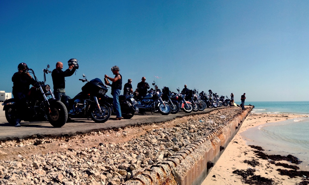 (File Photo) Bikers from the Harley Owner's Group (HOG) pull over at the Al Ghariya Beach, Madinat Ash Shamal to cool off during a Friday morning ride.  November 6, 2015. Qassim Rahmatullah © The Peninsula