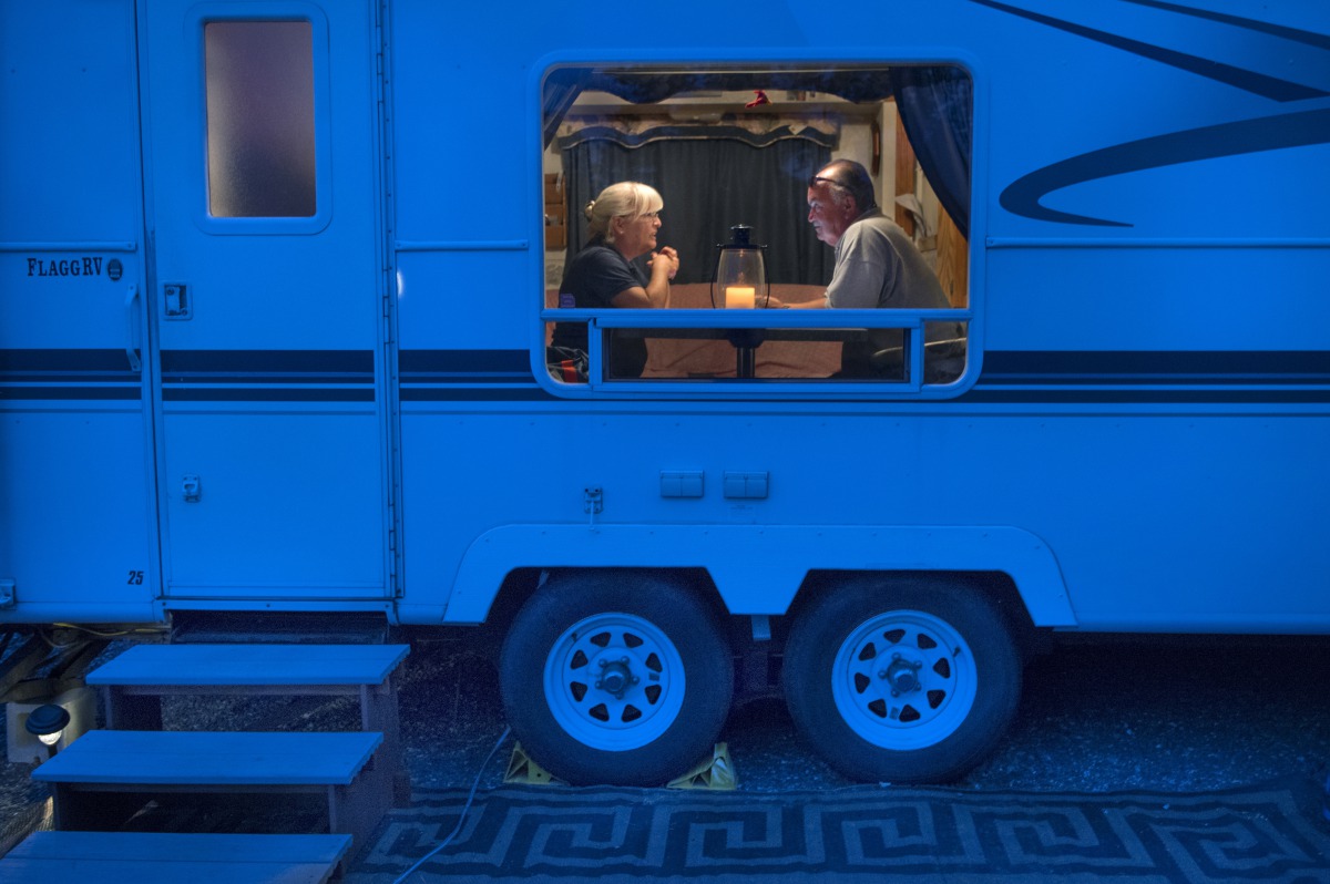 Joanne Molnar, 64, and husband Mark, 62, pictured on June 22 in the RV that has been their home for several years, managed a camping park in Trenton, Maine, for the summer season. Washington Post photo by Linda Davidson.