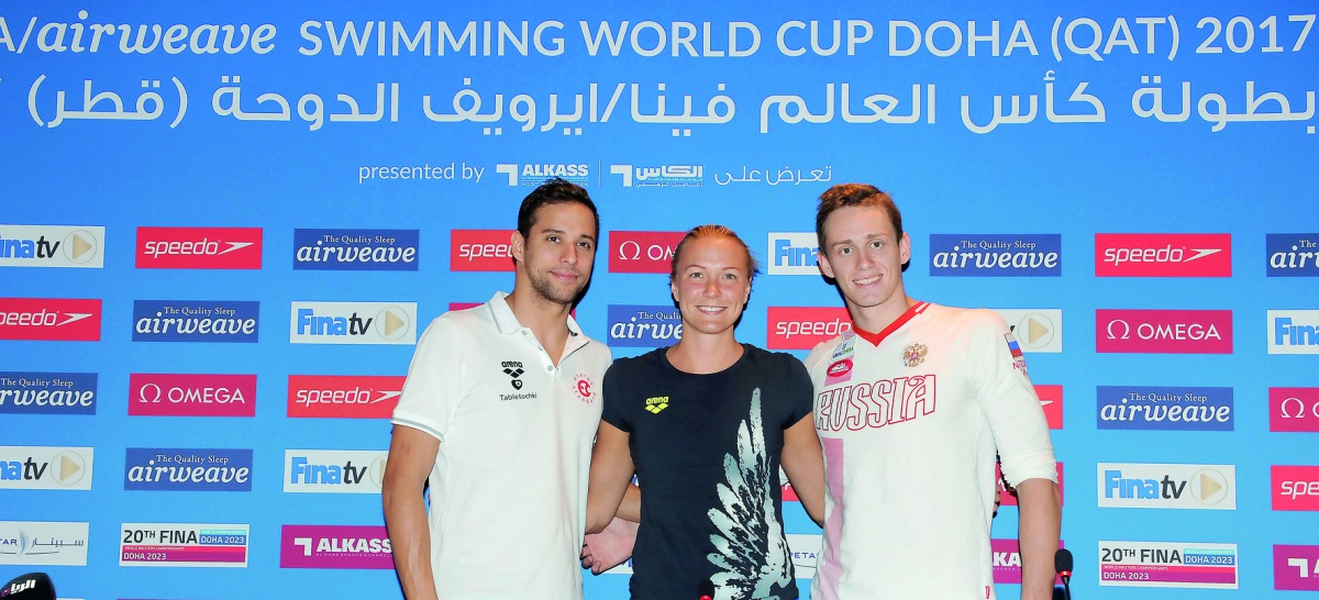 South African Olympic and World champion Chad le Clos (left), Swedish swimming sensation Sarah Sjostrom (centre) and Russian swimming ace Kirill Prigoda pose for a photograph following a press conference held on the eve of FINA airweave Swimming World Cup